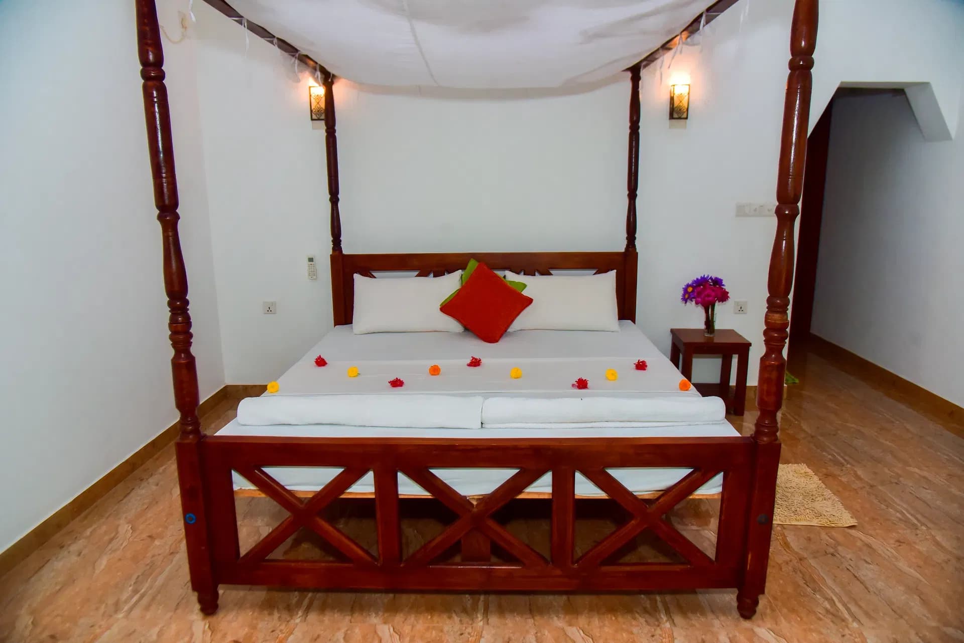 Deluxe room with elegant canopy bed